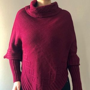 Poncho with sleeves and high neck